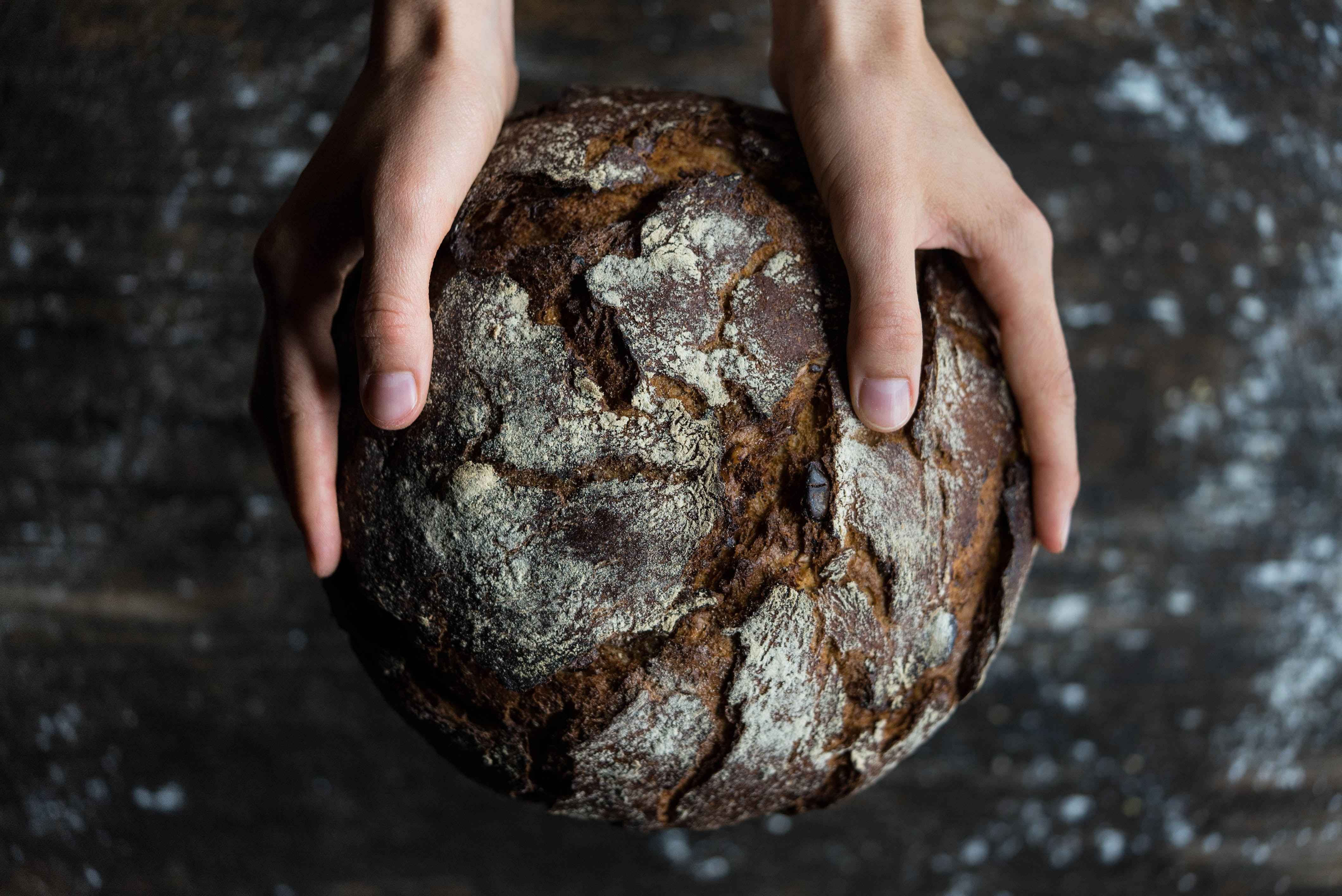 Holding fresh baked bread